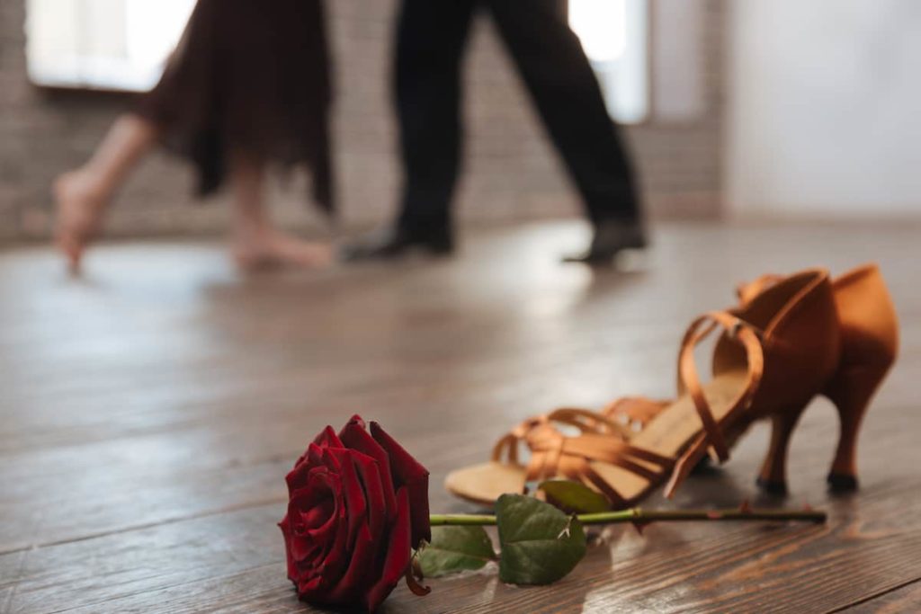 gold ballroom dance shoes rose dancers in background