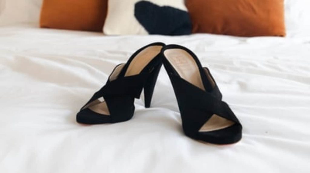 black salsa shoes on bed sandals high heels