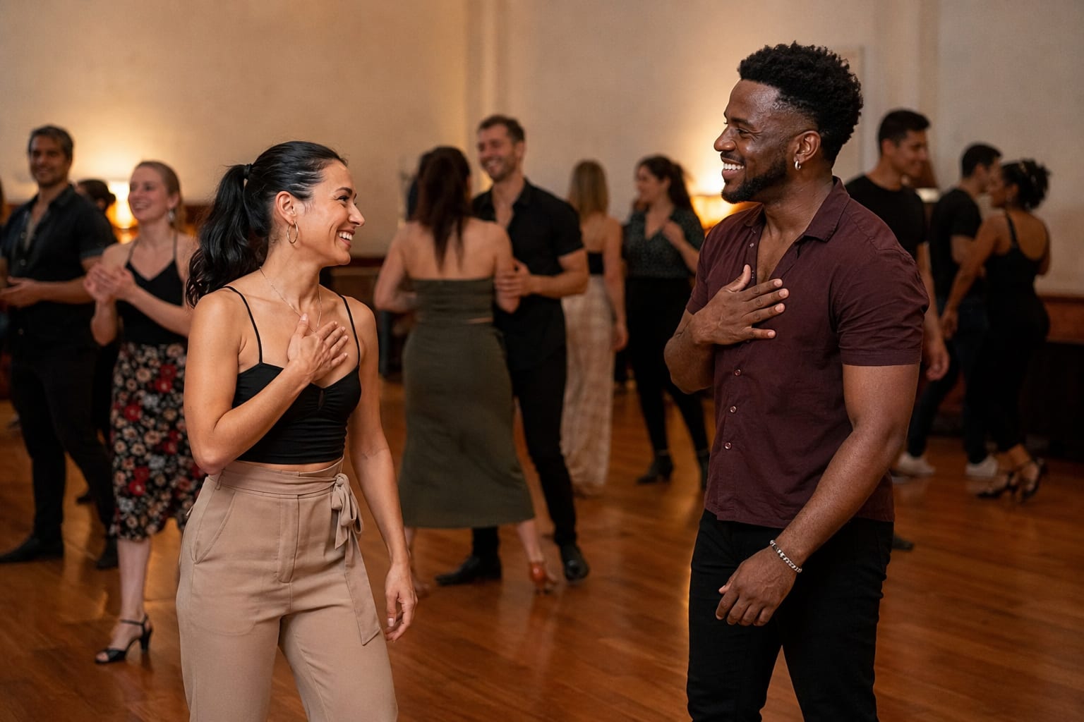 Two salsa dancers thanking each other after a song