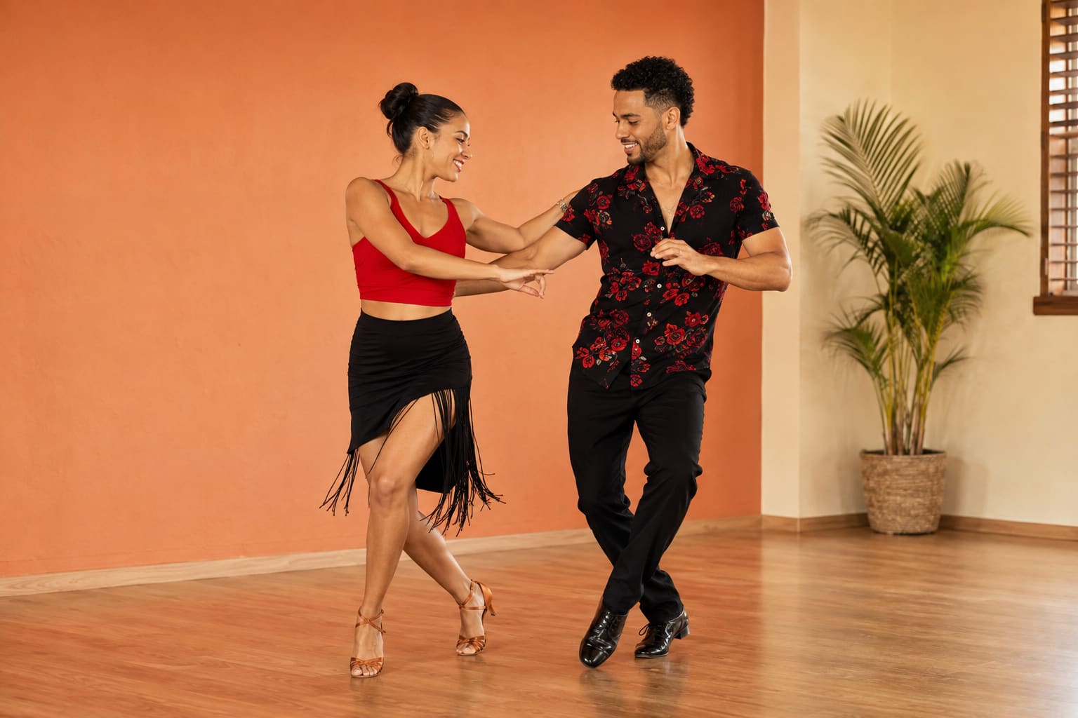 Bachata couple dancing lively Dominican-style footwork in open hold